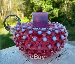 Fenton glass hobnail cranberry opalescent cruet, candle holders, shakers