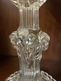 Pair of cut glass candlesticks decorated with lions' and rams' heads, late