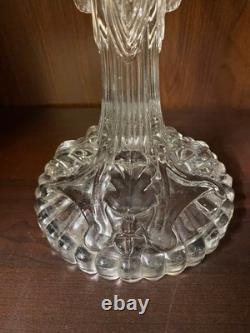 Pair of cut glass candlesticks decorated with lions' and rams' heads, late